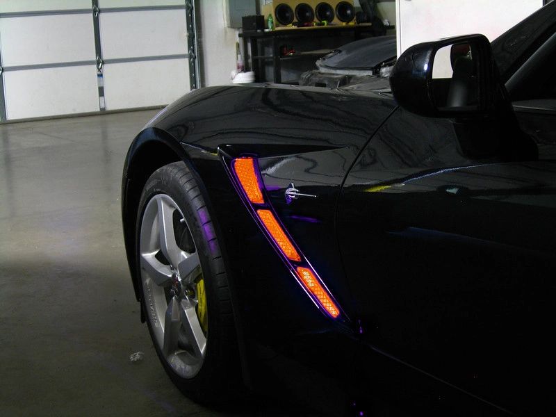 Black Corvette with orange fender cove lighting